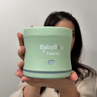 Verified BabyBoo customer holding her warmer